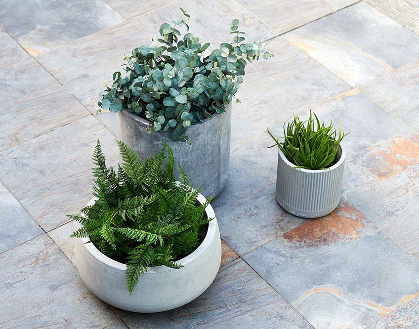 UGGLA, ILDROVFLUE and FLUGA planters Three garden planters on a patio