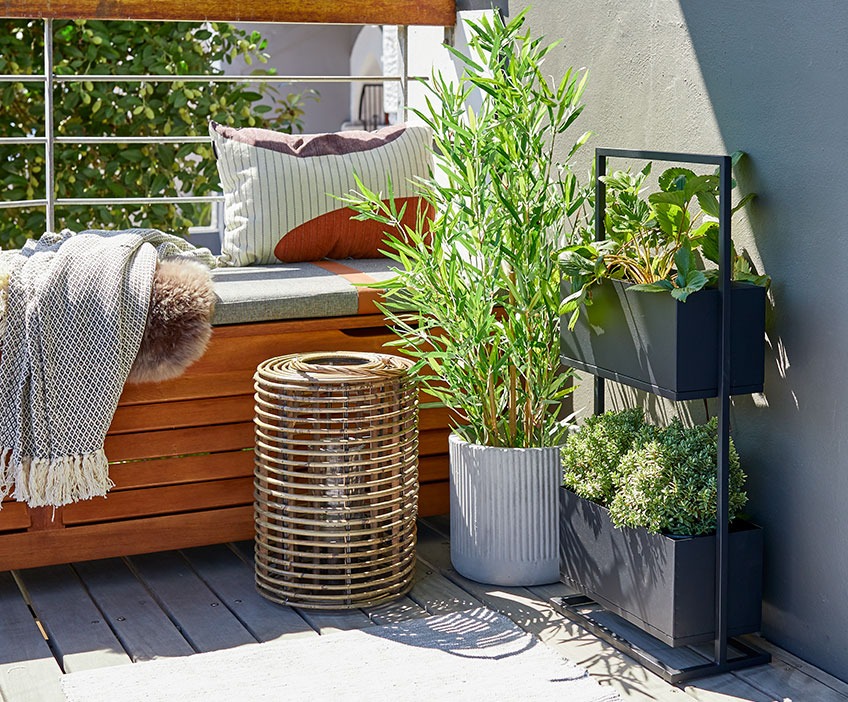 Outdoor lantern and balcony planter in two stories on a balcony