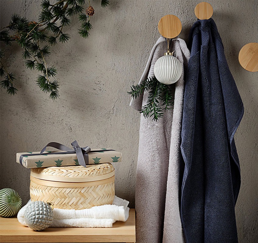 Grey and dark blue towels and decorative basket